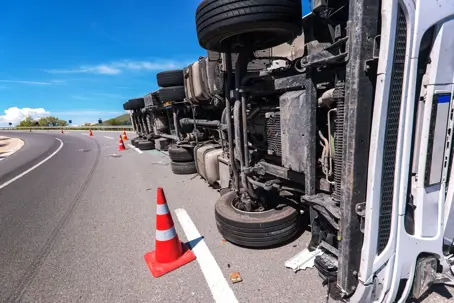 a flipped over 18 wheeler
