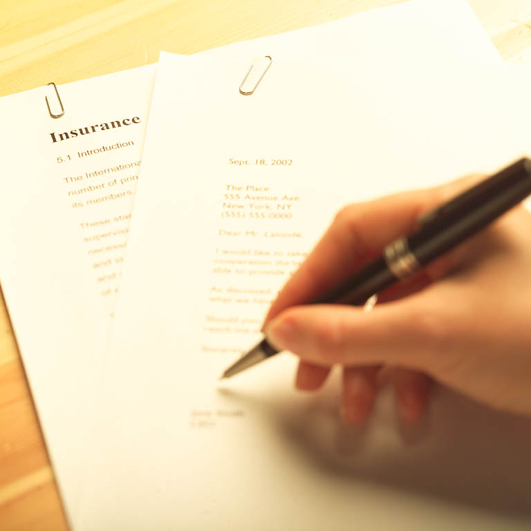 A close-up shows the upper portion of a letter with a date, address, and salutation.